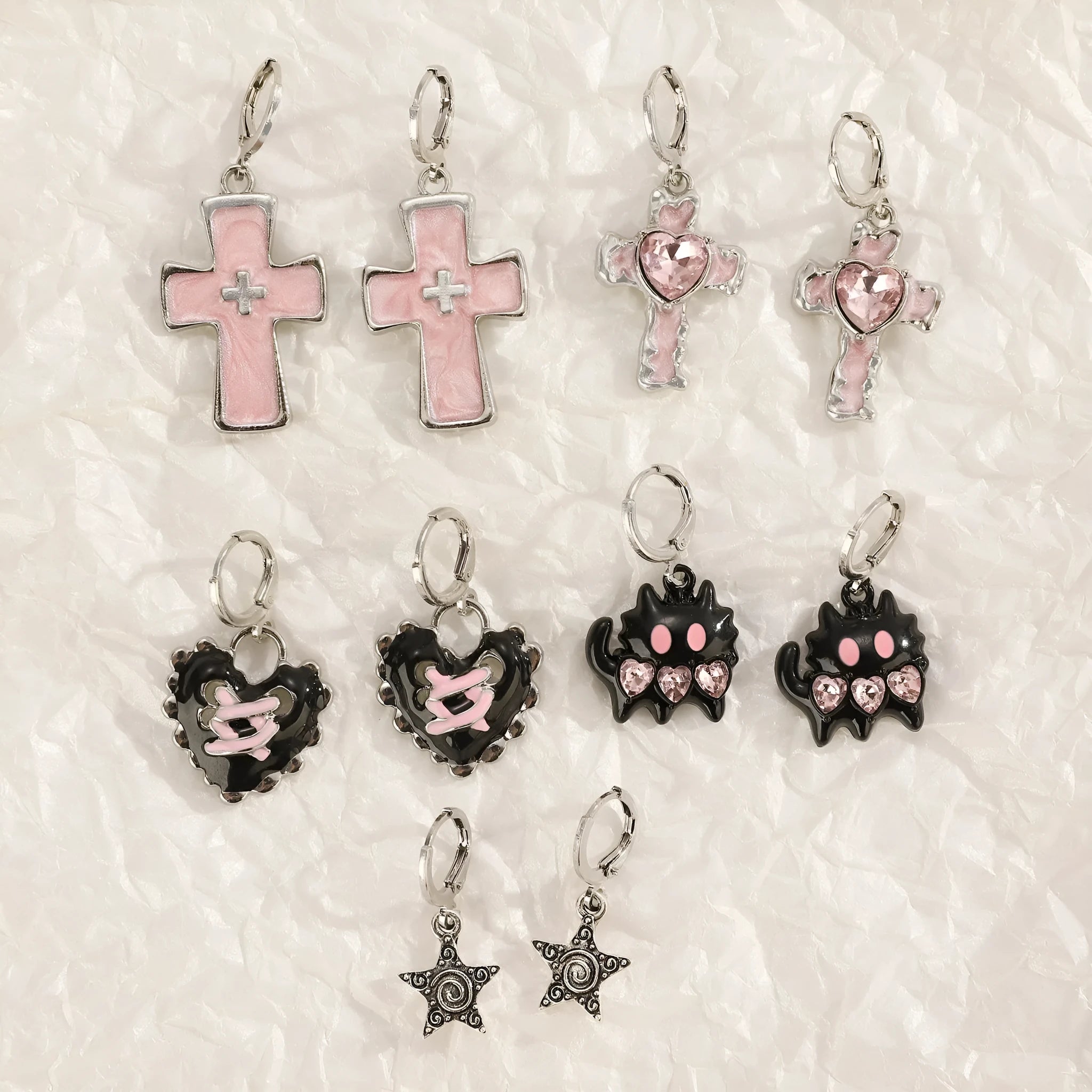 Women's alloy cross crystal earrings in white, bright black, and antique silver colours with geometric animal designs