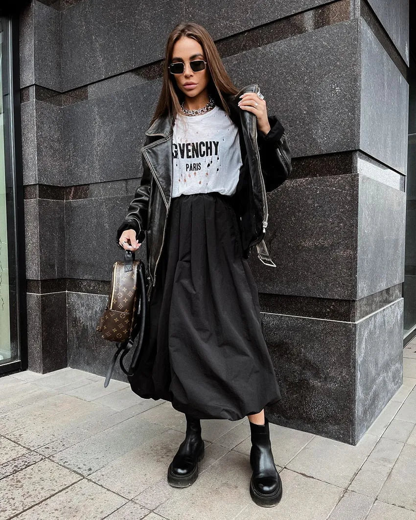 Women's long solid colour cotton skirt with elastic waist in black or white.