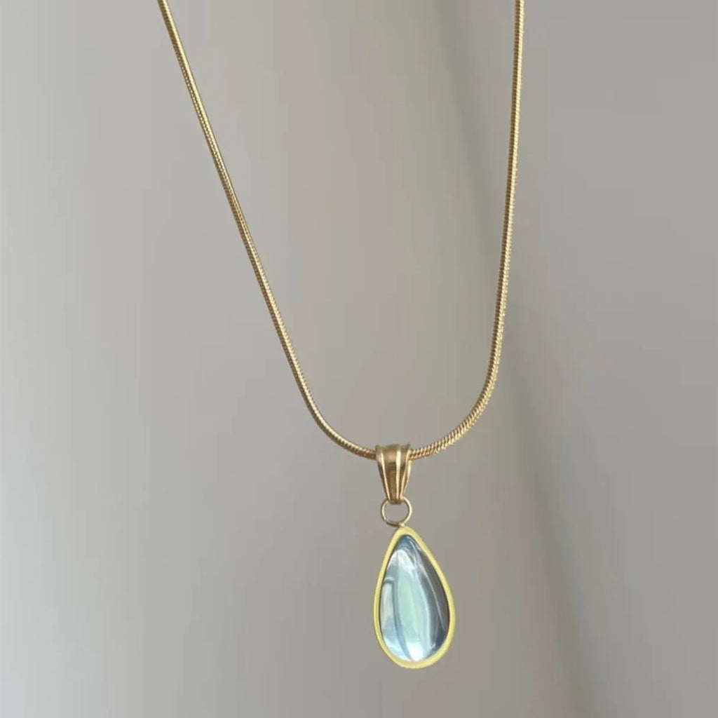 Retro water drop necklace with blue gemstone pendant on a titanium steel snake bone chain.