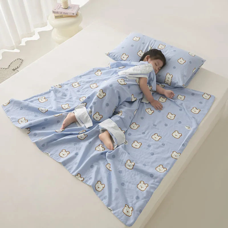 Anti-kick sleeping bag blanket in a colourful Cloud Bear Star Dream design on a bed.