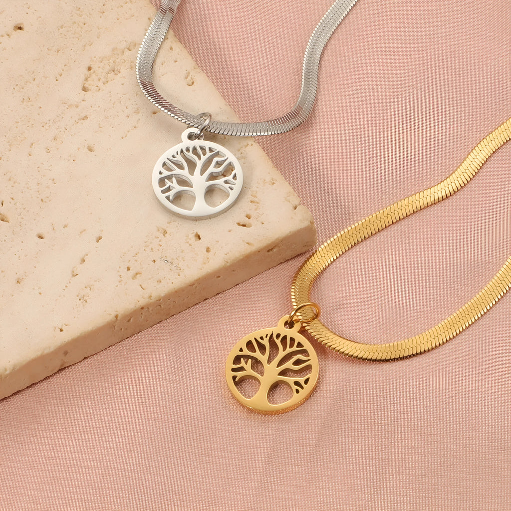 Stainless steel lucky tree pendant necklace on a snake bone chain, shown in gold and steel colour options.