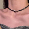 Women's twin necklace set with alloy heart pendants, artificial crystal details, and leather elements on clavicle chains