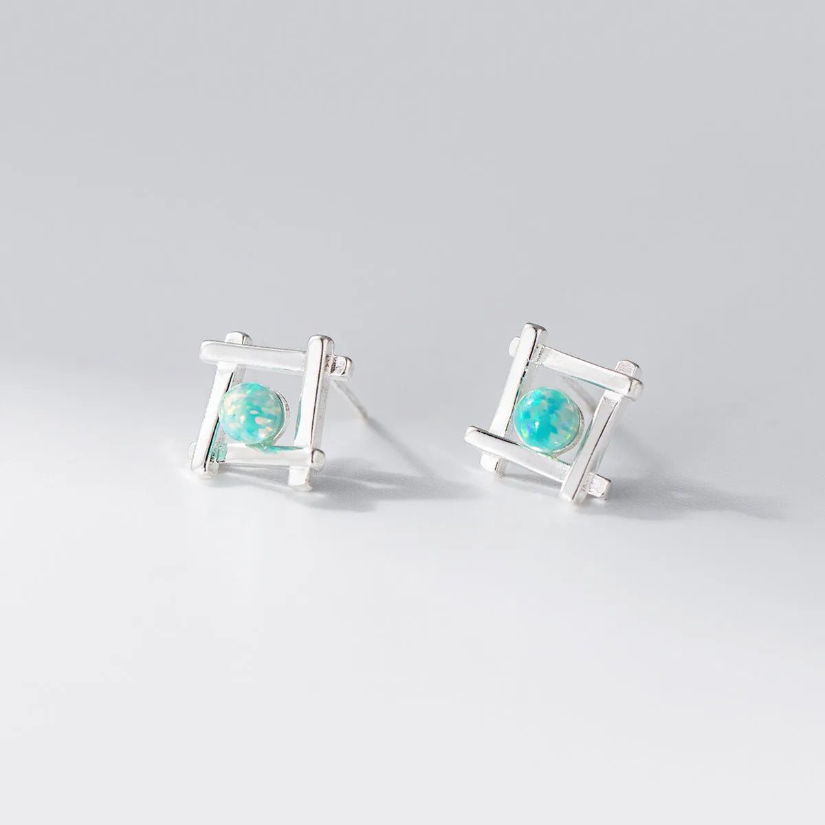 Women's geometric cross quadrangle stud earrings in 925 silver with silver or gold finish