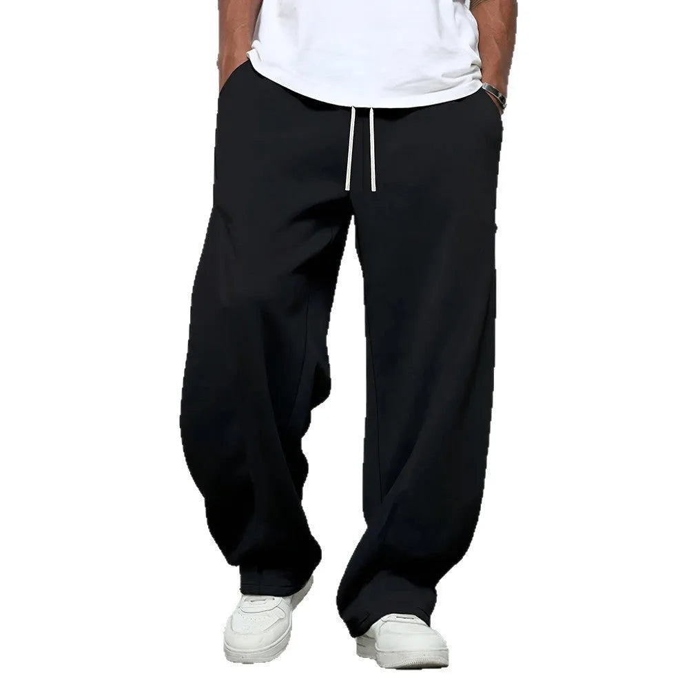 Men's straight-leg casual trousers in black with a micro-elastic waistband and drawstring closure.