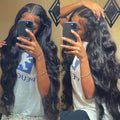 Black synthetic front lace wig with long curly hair and exotic side bangs in various length options