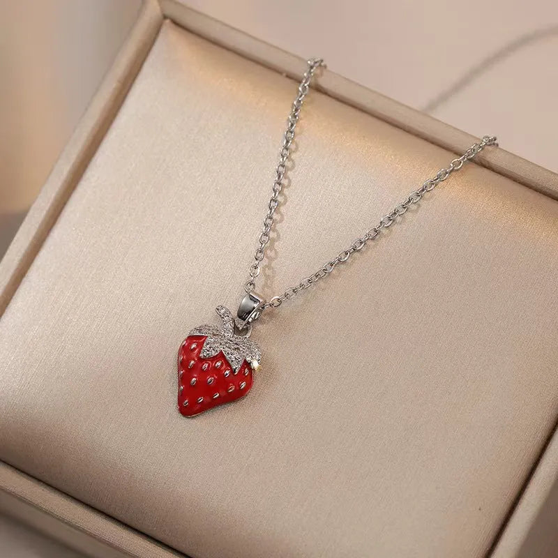 Delicate indie women's necklace with cherry, strawberry and pepper charms on a titanium steel O-ring chain.