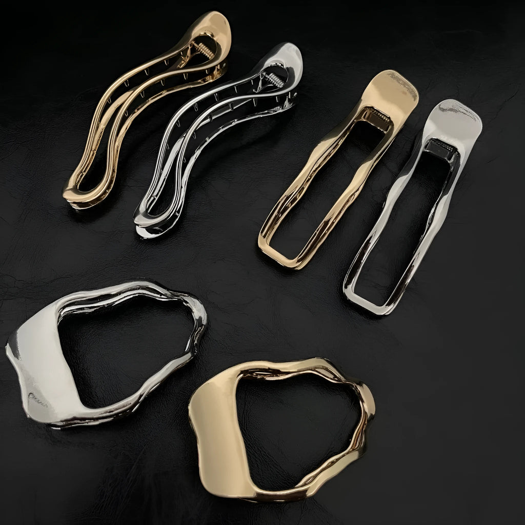 Gold and silver zinc alloy hair barrettes in square, arc, and triangle shapes.