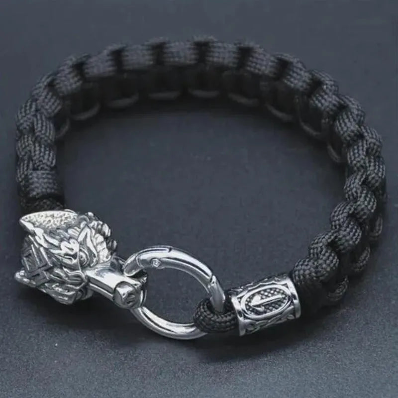 Handmade titanium steel wolf head bracelet in camouflage colour on wrist.