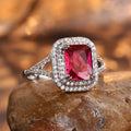 Square red copper women's ring with a central rhinestone on a white background.
