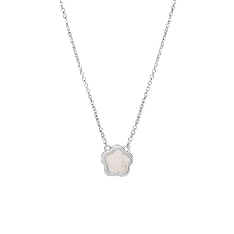 White mother of pearl shell flower necklace on a chain, shown in silver and gold tone finishes.