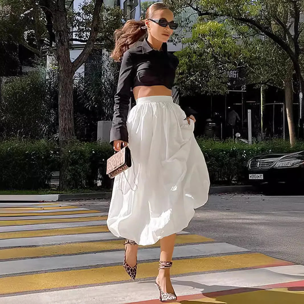 Women's long solid colour cotton skirt with elastic waist in black or white.