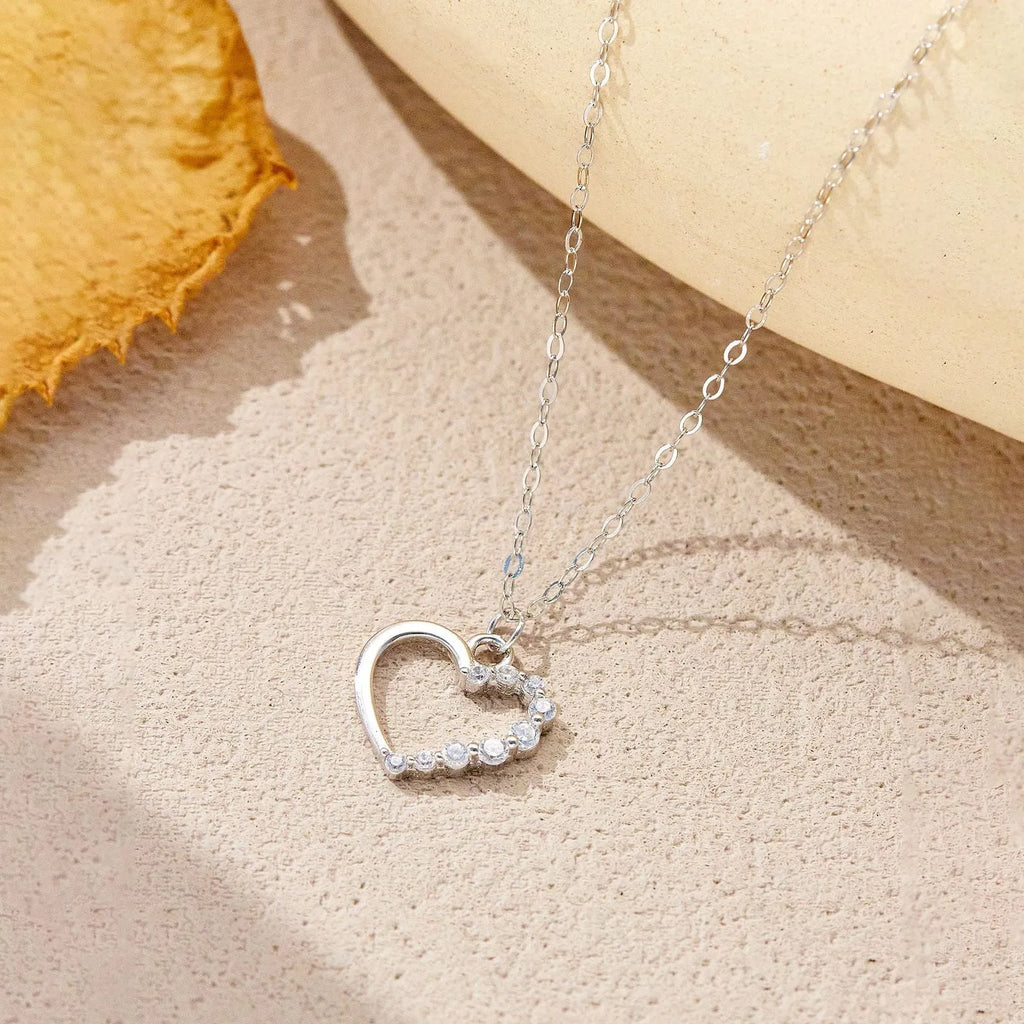 Sterling silver hollow heart necklace with regular chain in silver tone