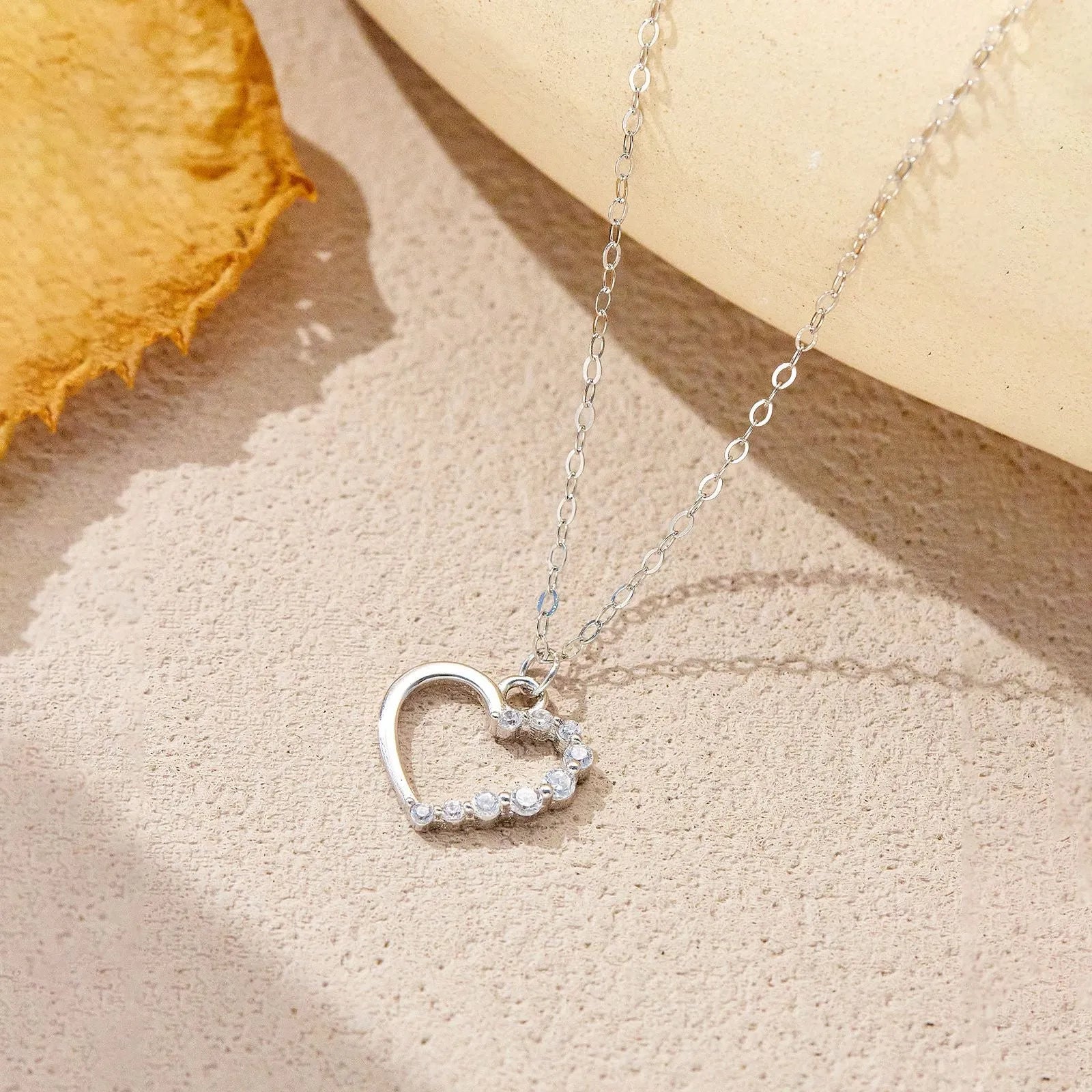 Sterling silver hollow heart necklace with regular chain in silver tone