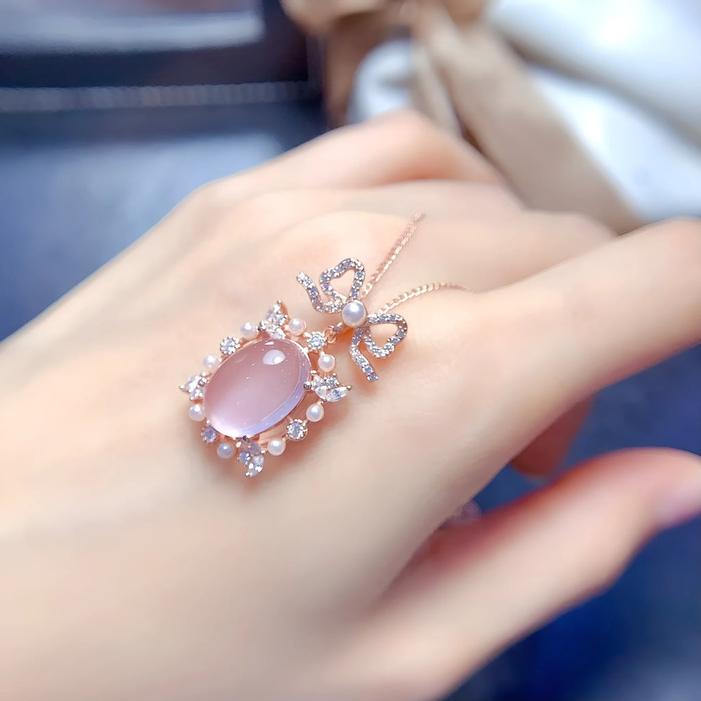 Geometric pendant necklace with pink rose quartz, silver chain, and rose gold plating