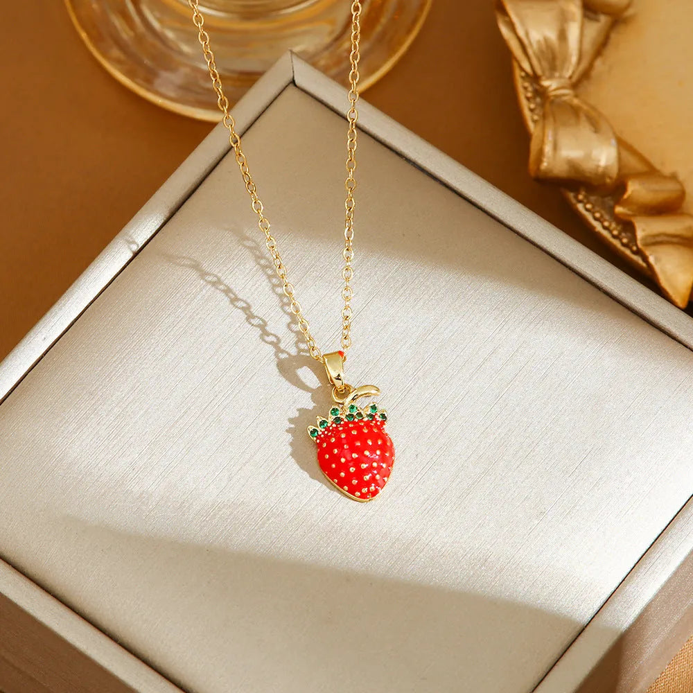 Delicate indie women's necklace with cherry, strawberry and pepper charms on a titanium steel O-ring chain.