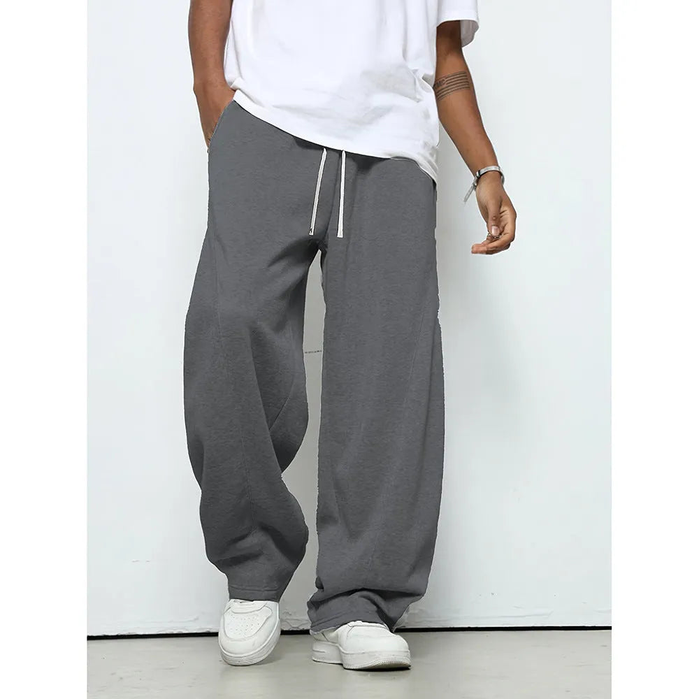 Men's straight-leg casual trousers in black with a micro-elastic waistband and drawstring closure.