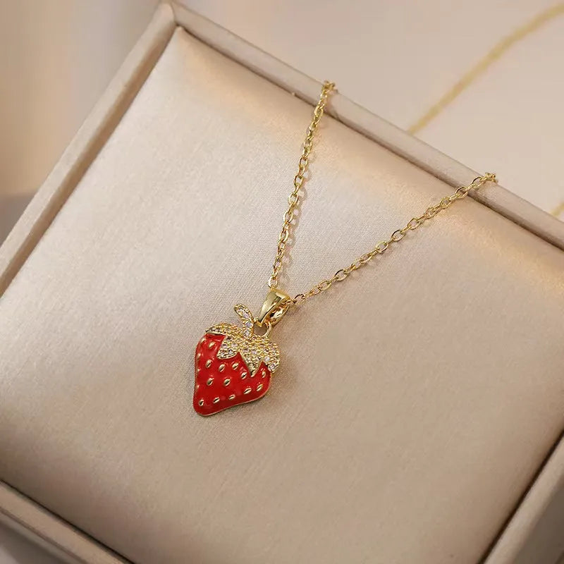 Delicate indie women's necklace with cherry, strawberry and pepper charms on a titanium steel O-ring chain.
