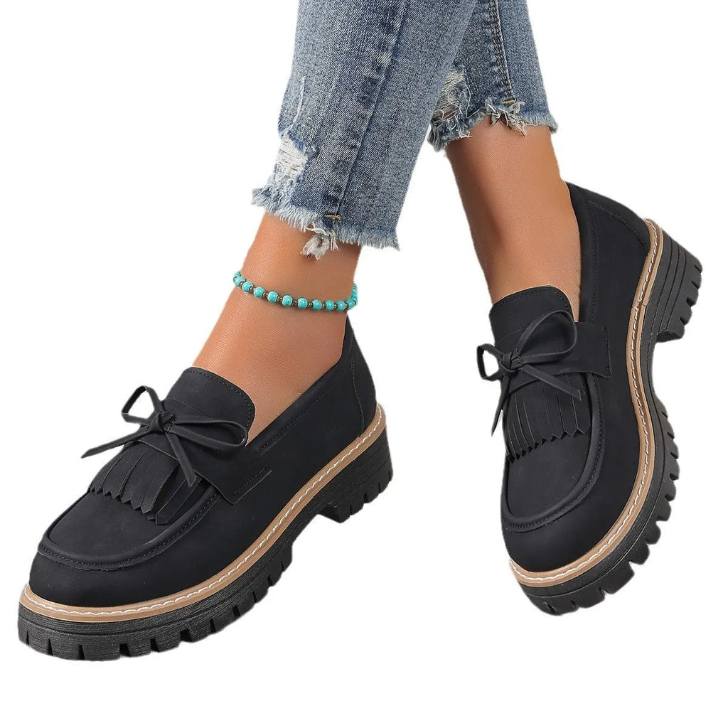Plus size women's loafers with tassel bowknot detail in black or brown colours with chunky rubber sole