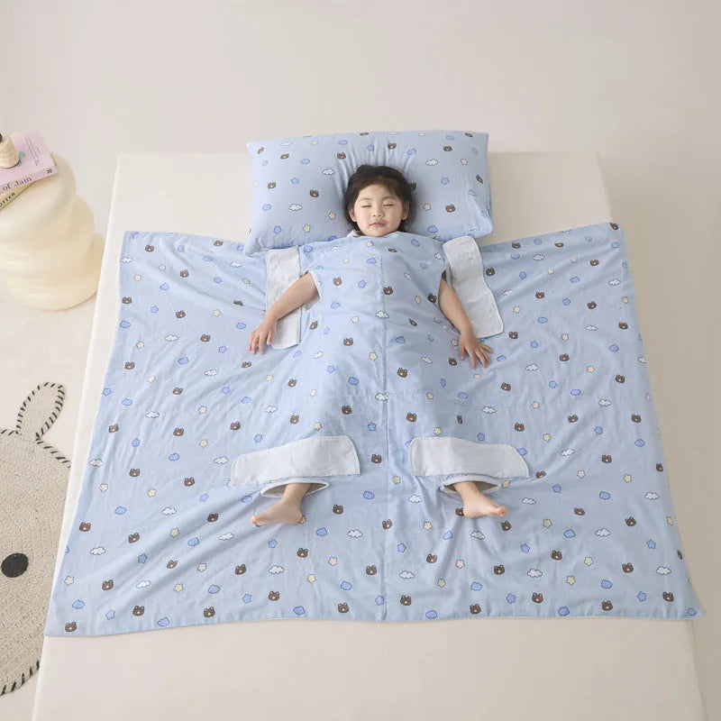 Anti-kick sleeping bag blanket in a colourful Cloud Bear Star Dream design on a bed.