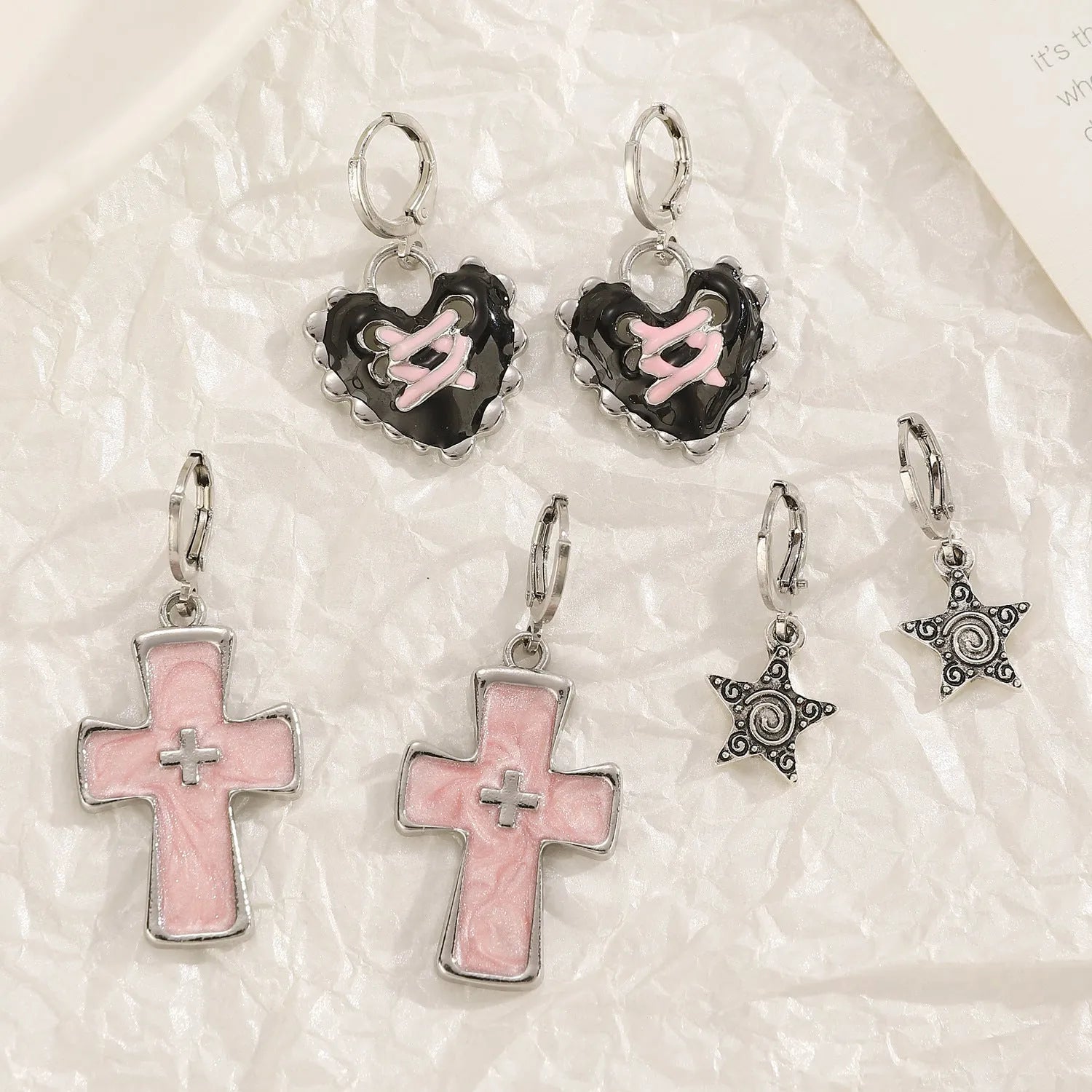 Women's alloy cross crystal earrings in white, bright black, and antique silver colours with geometric animal designs