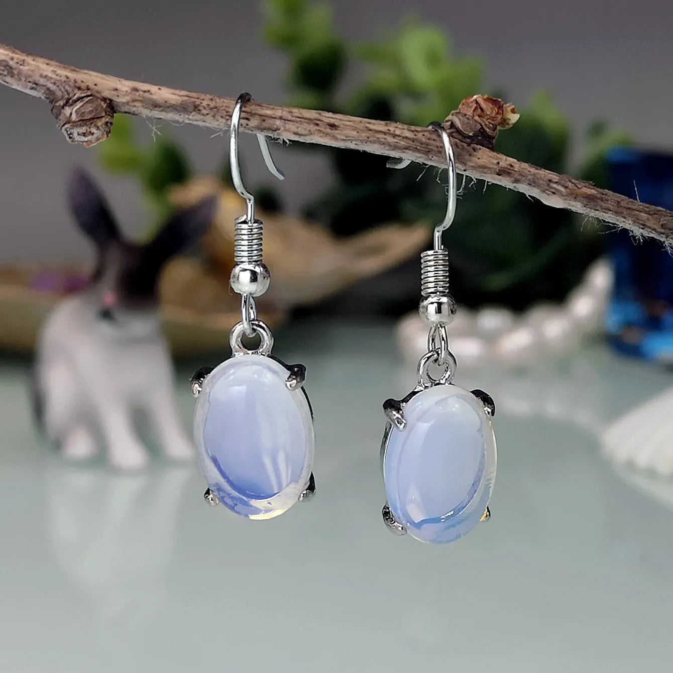 Opal earrings with retro moonstone cross design in drop shape and electroplated alloy construction