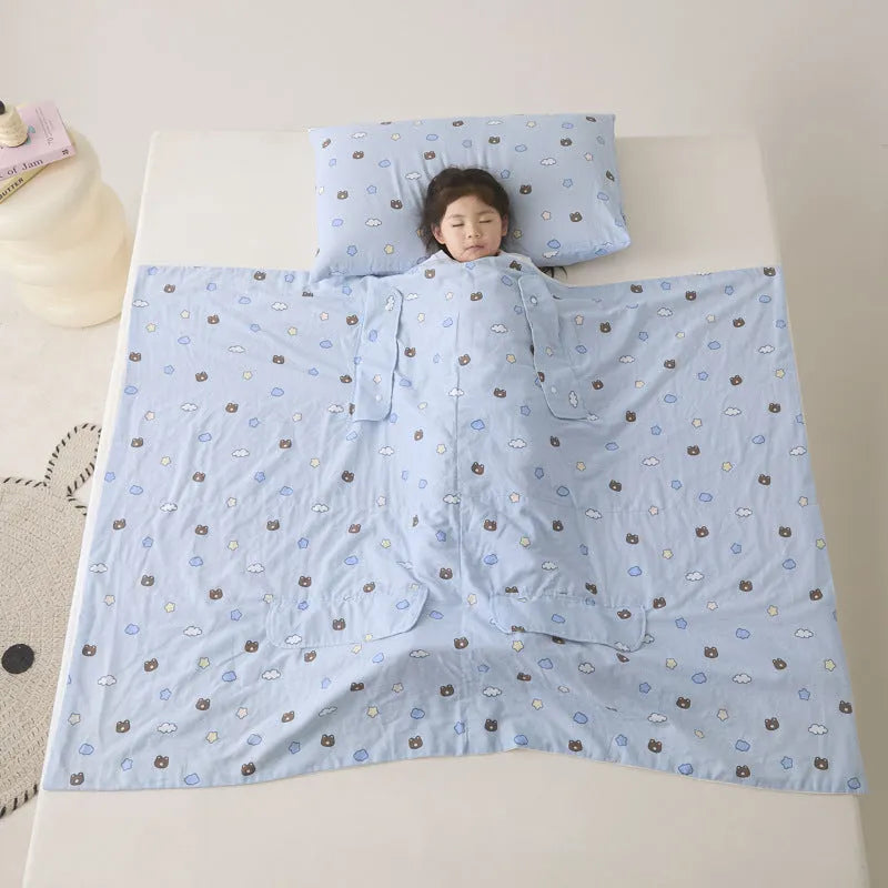 Anti-kick sleeping bag blanket in a colourful Cloud Bear Star Dream design on a bed.