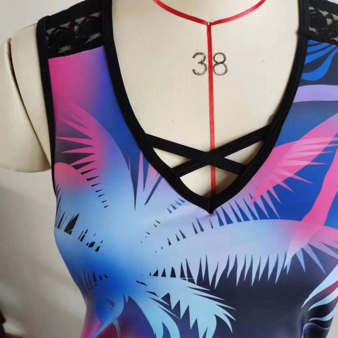 Women's blue floral printed lace two-piece bikini swimsuit on a mannequin.