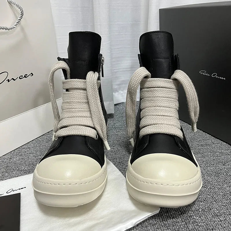 Black high-top leather boots with side zip and platform sole for men and women