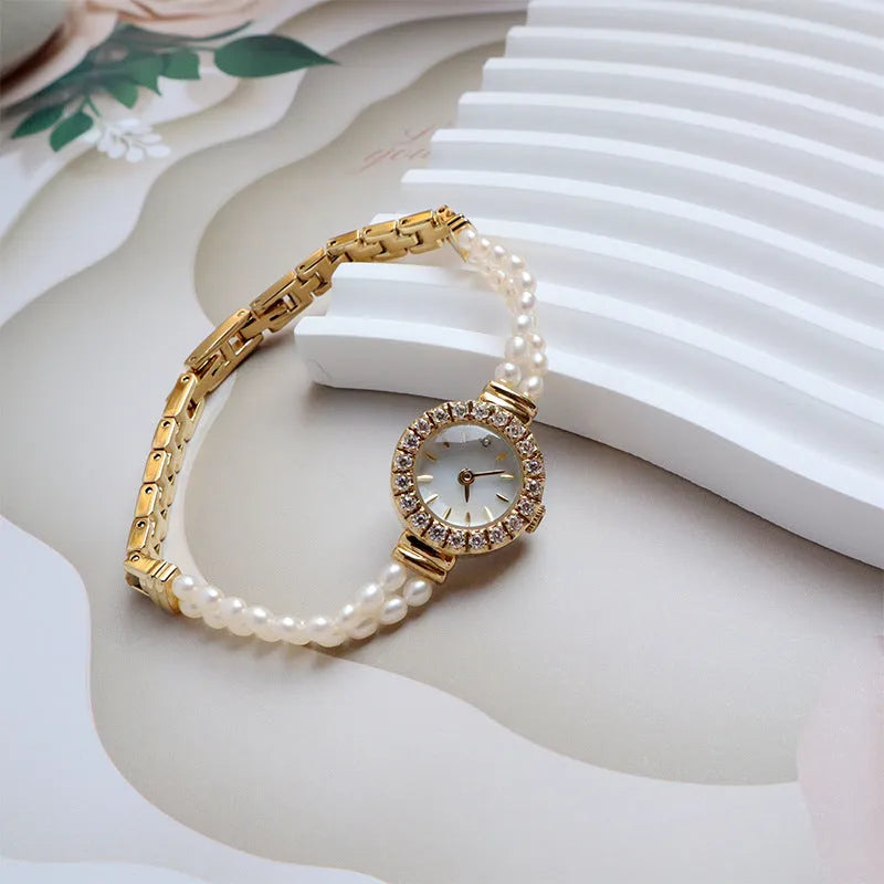 Women's light gold bracelet watch with natural freshwater pearls and round 18mm dial