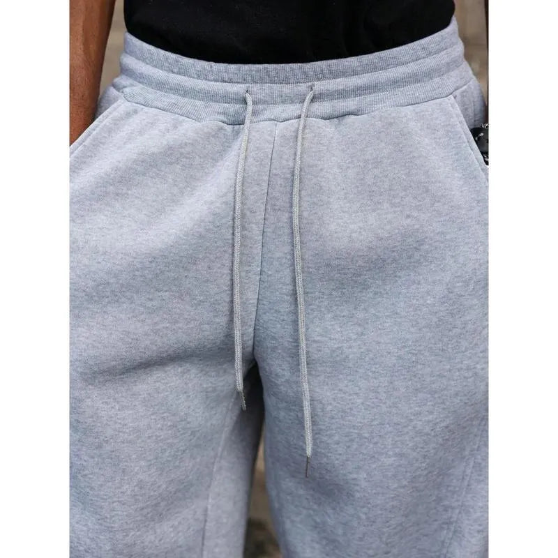 Men's straight-leg high waist casual trousers in a cropped length, shown in a dark grey colour.