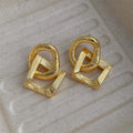 Retro geometric copper circle pendant earrings in gold or silver, 3.4cm tall.
