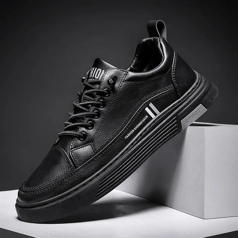 Men's low-top skate shoes in black with elastic band fastening and round toe.