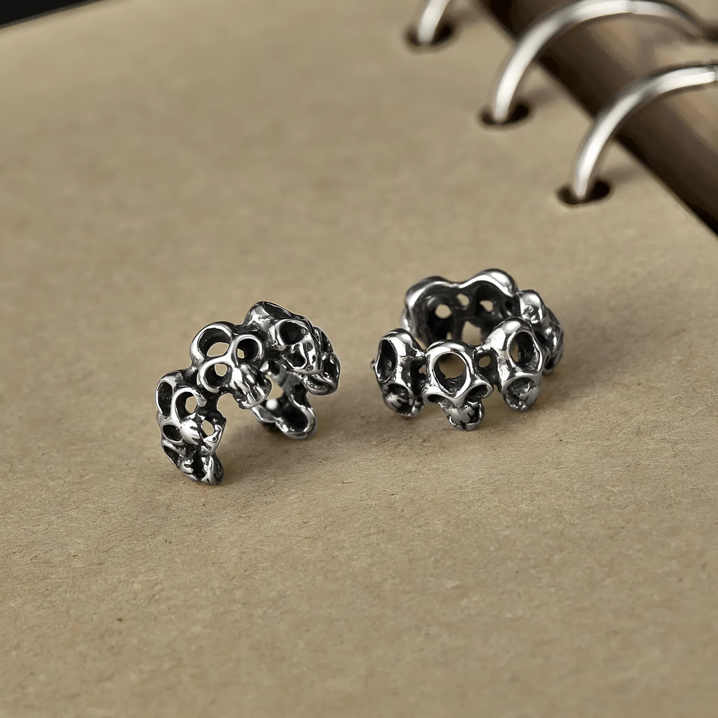 Stainless steel skull ear clip earrings with geometric hollow design and metallic finish