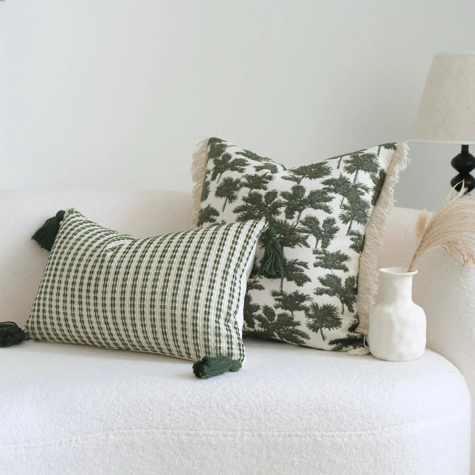 Green cotton linen hotel sample pillow with tassel detail in striped or leaf patterns
