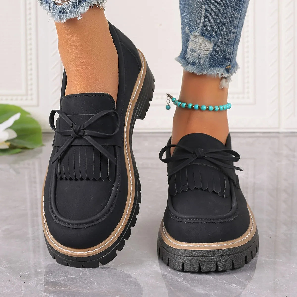 Plus size women's loafers with tassel bowknot detail in black or brown colours with chunky rubber sole