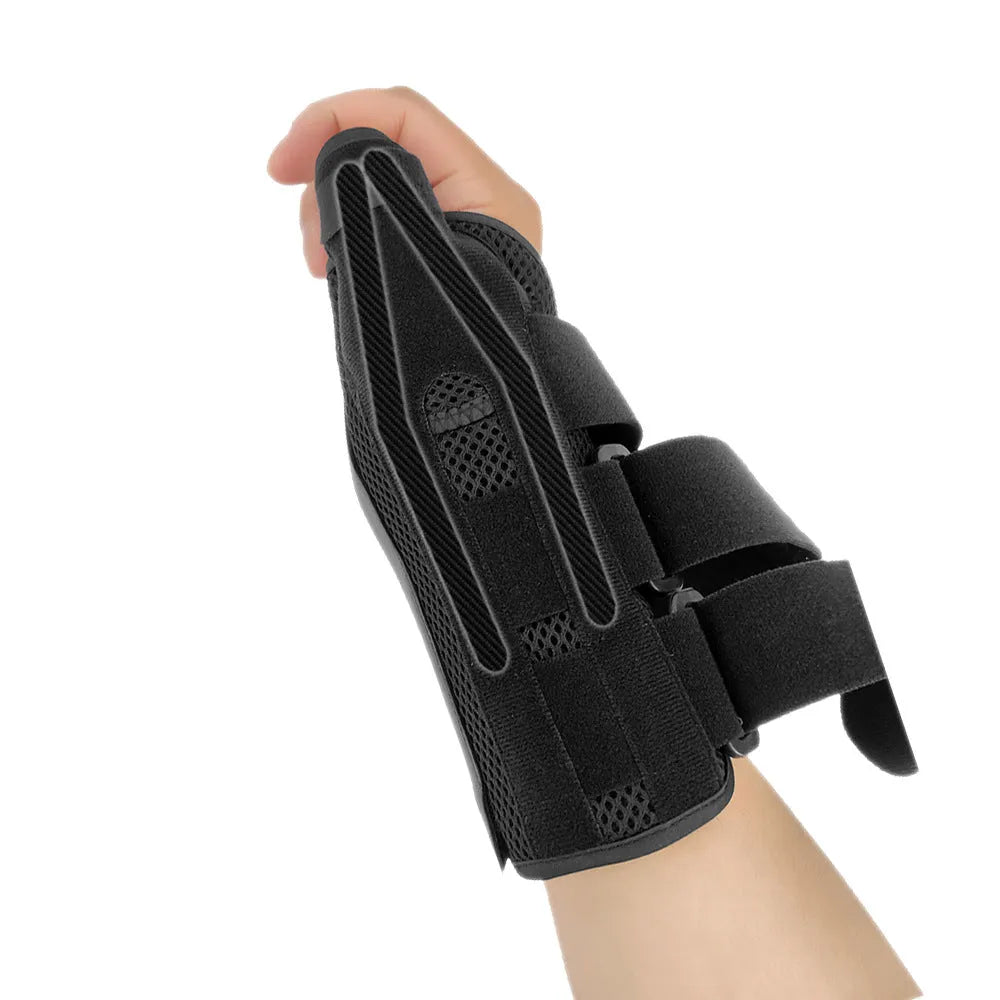 Black sports wrist guard with grey edging and a thumb strap, showing carbon fibre reinforcement panel.