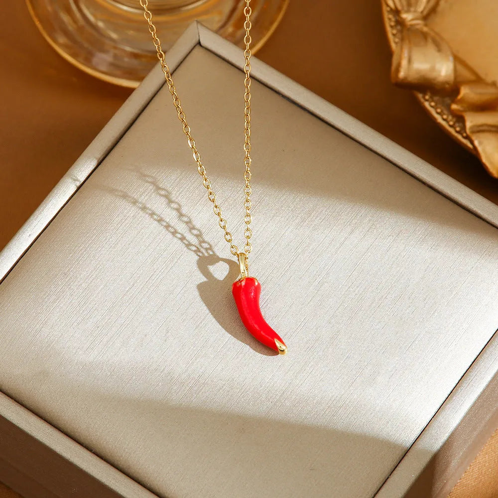 Delicate indie women's necklace with cherry, strawberry and pepper charms on a titanium steel O-ring chain.