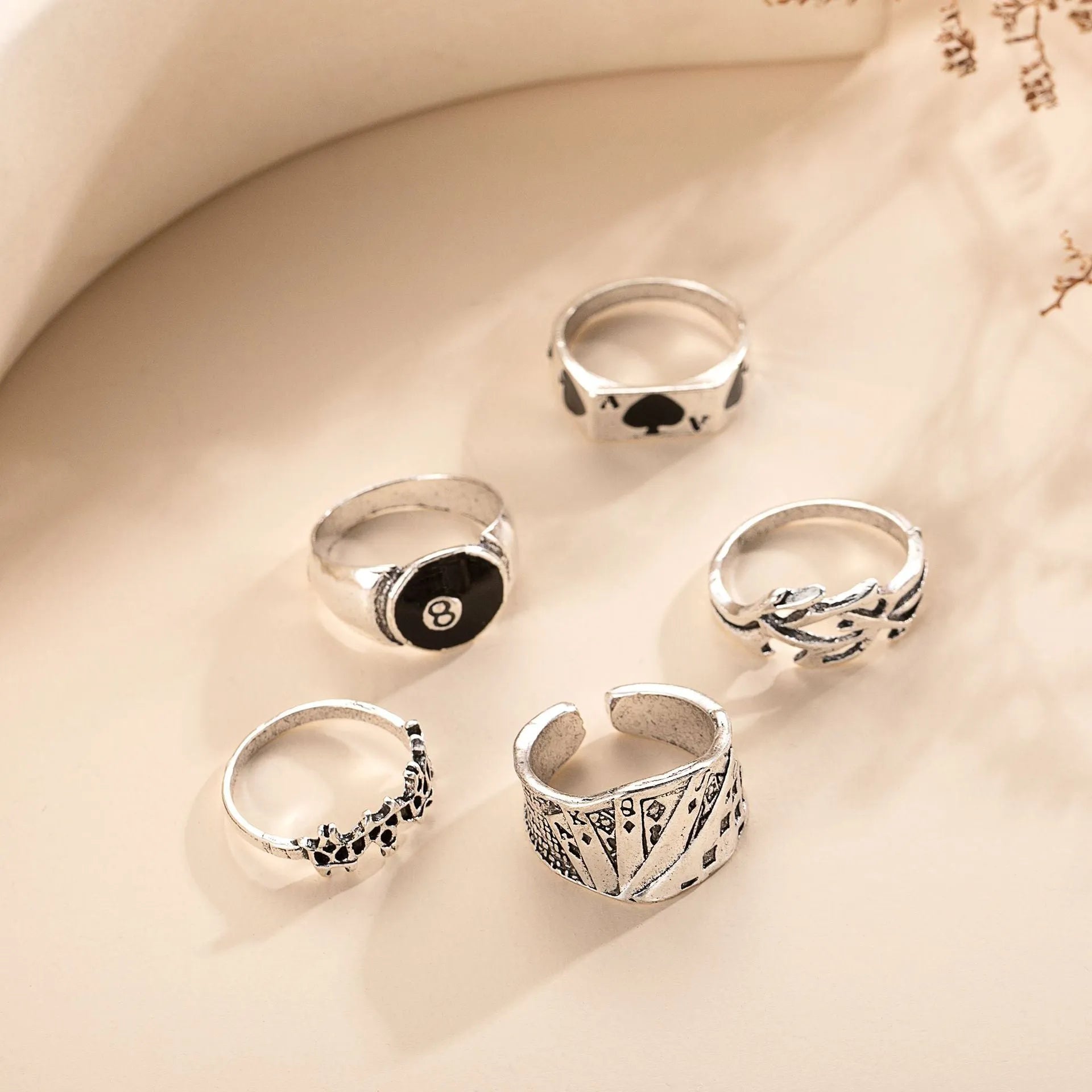 Black alloy ring with a raised retro spade card symbol and an adjustable band.