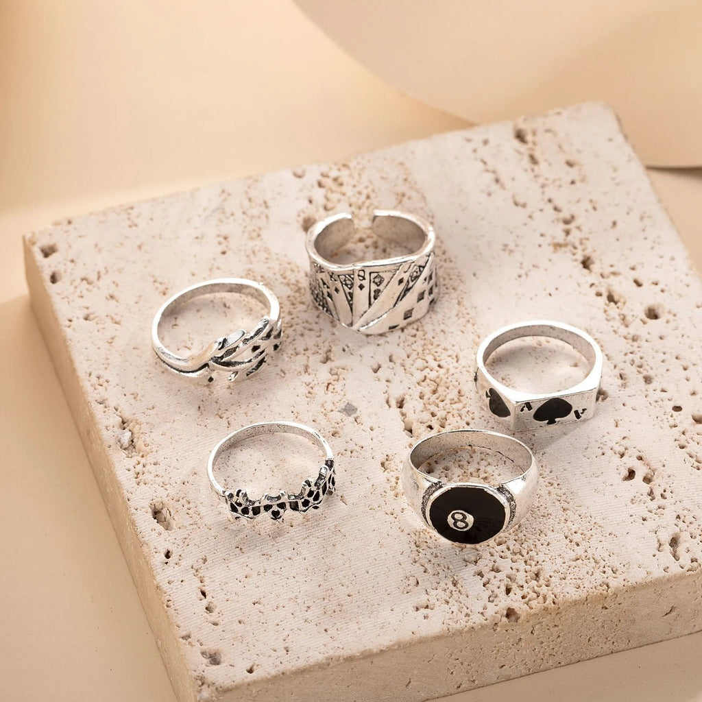 Black alloy ring with a raised retro spade card symbol and an adjustable band.