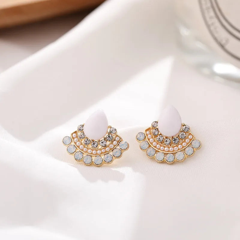 Women's silver geometric fan-shaped drop earrings with a central opal rhinestone.