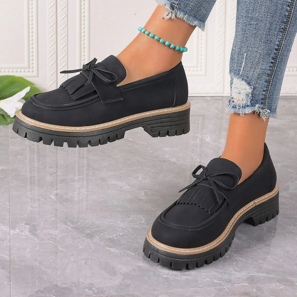 Plus size women's loafers with tassel bowknot detail in black or brown colours with chunky rubber sole