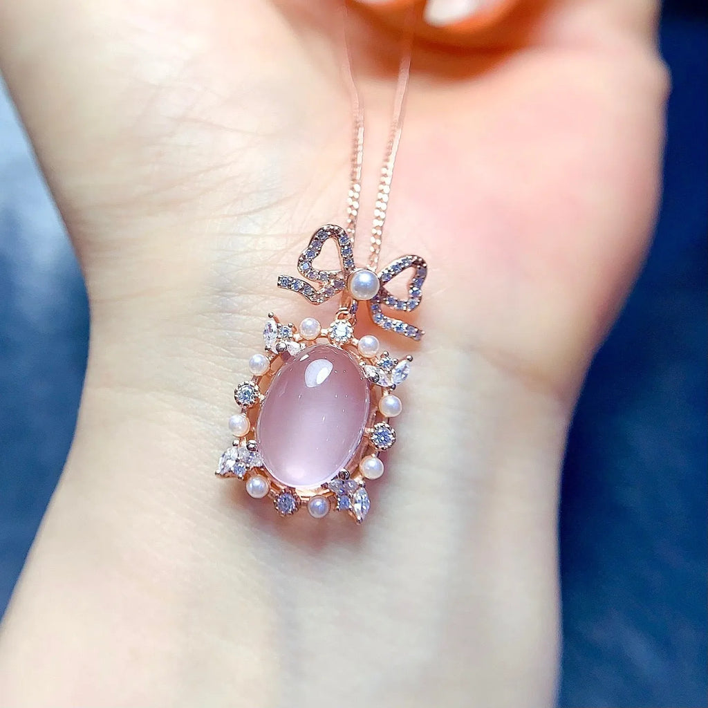 Geometric pendant necklace with pink rose quartz, silver chain, and rose gold plating
