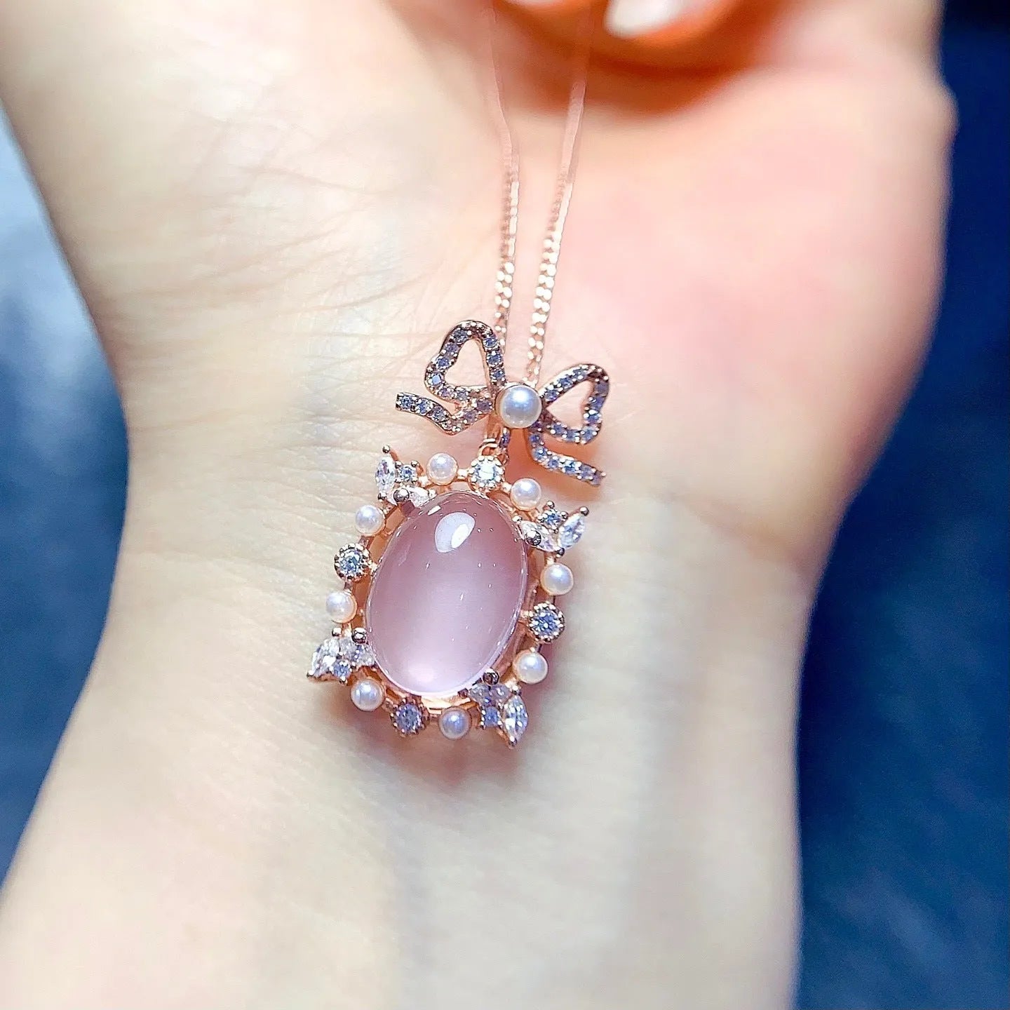 Geometric pendant necklace with pink rose quartz, silver chain, and rose gold plating