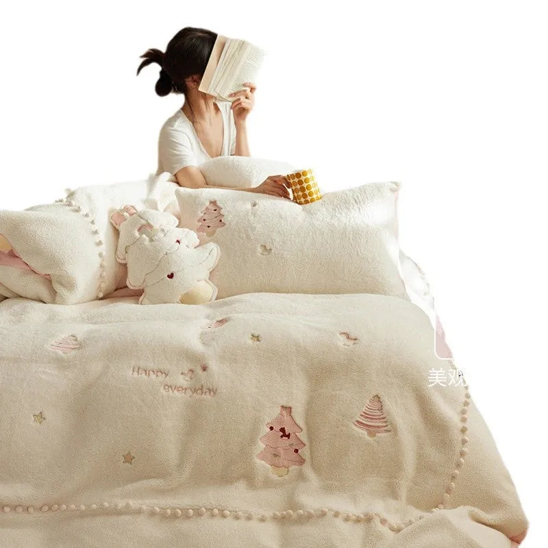 Winter milk fibre four-piece bedding set with green Christmas tree pattern on bed