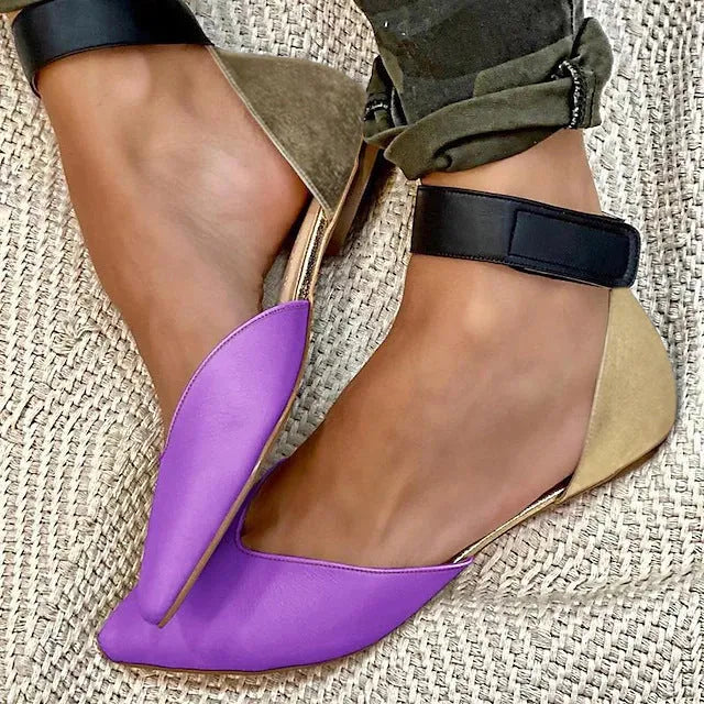 Women's beige hollowed sandals with adjustable velcro straps, shown from the side.