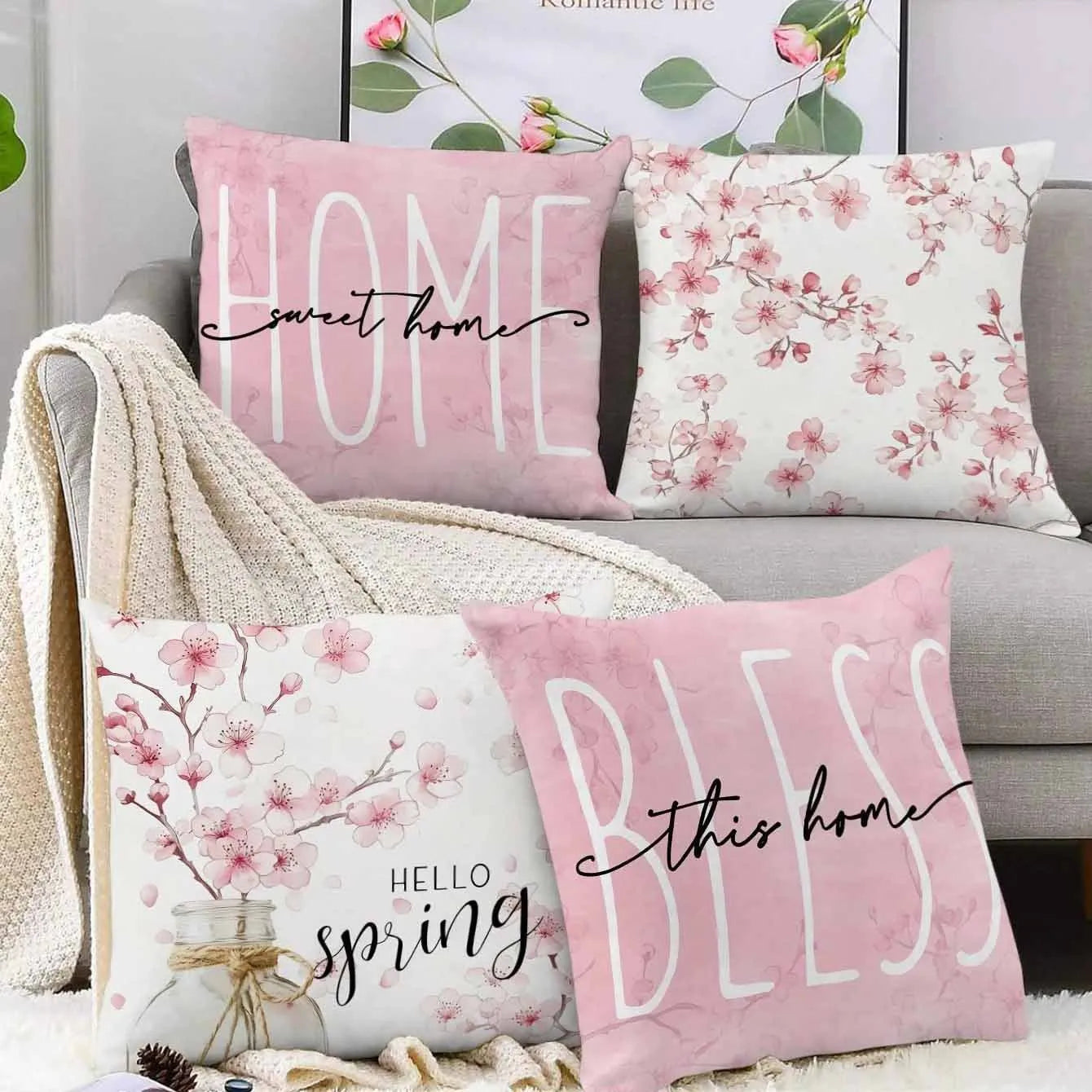 45cm square cherry blossom print cushion cover in short velvet fabric on a grey sofa.