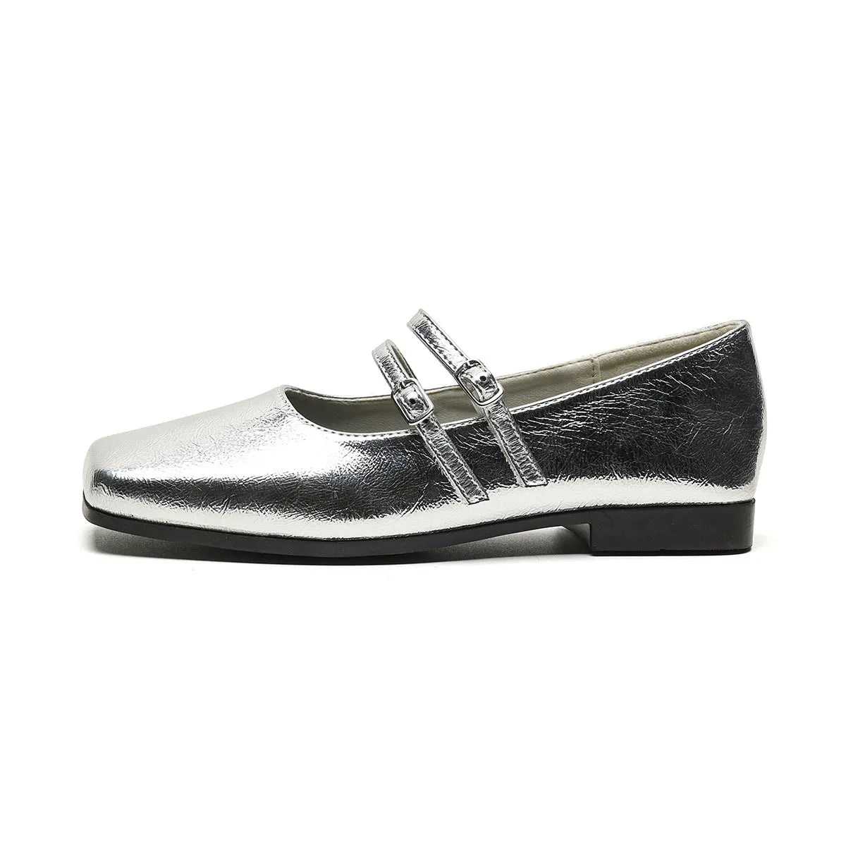 Silver women's Mary Jane ballet flats with cross buckle strap and round toe on flat low heel.