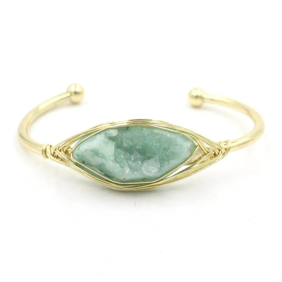 Raw gemstone winding bracelet with 8mm amorphous crystal beads in various colours on a white background.