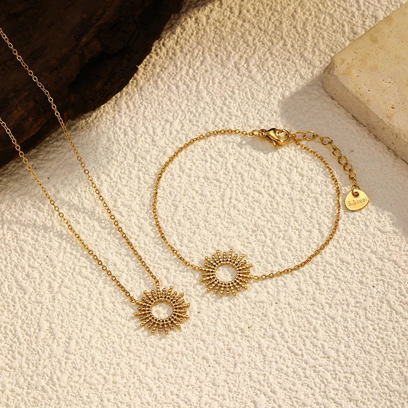 Sunflower jewellery set with gold necklace and bracelet featuring geometric chain design