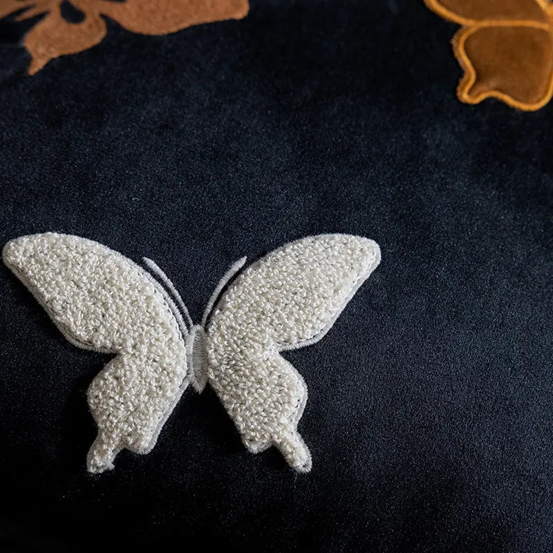 Square butterfly embroidered cushion in beige, black, or purple colour options